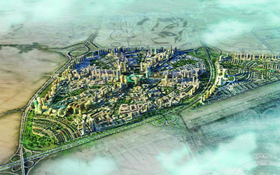 Aerial view of a large, well-planned residential community development with villas and green spaces (JVC or JVT area). Local home movers serving Jumeirah Village Circle and Triangle by dubaicitymovers.ae.